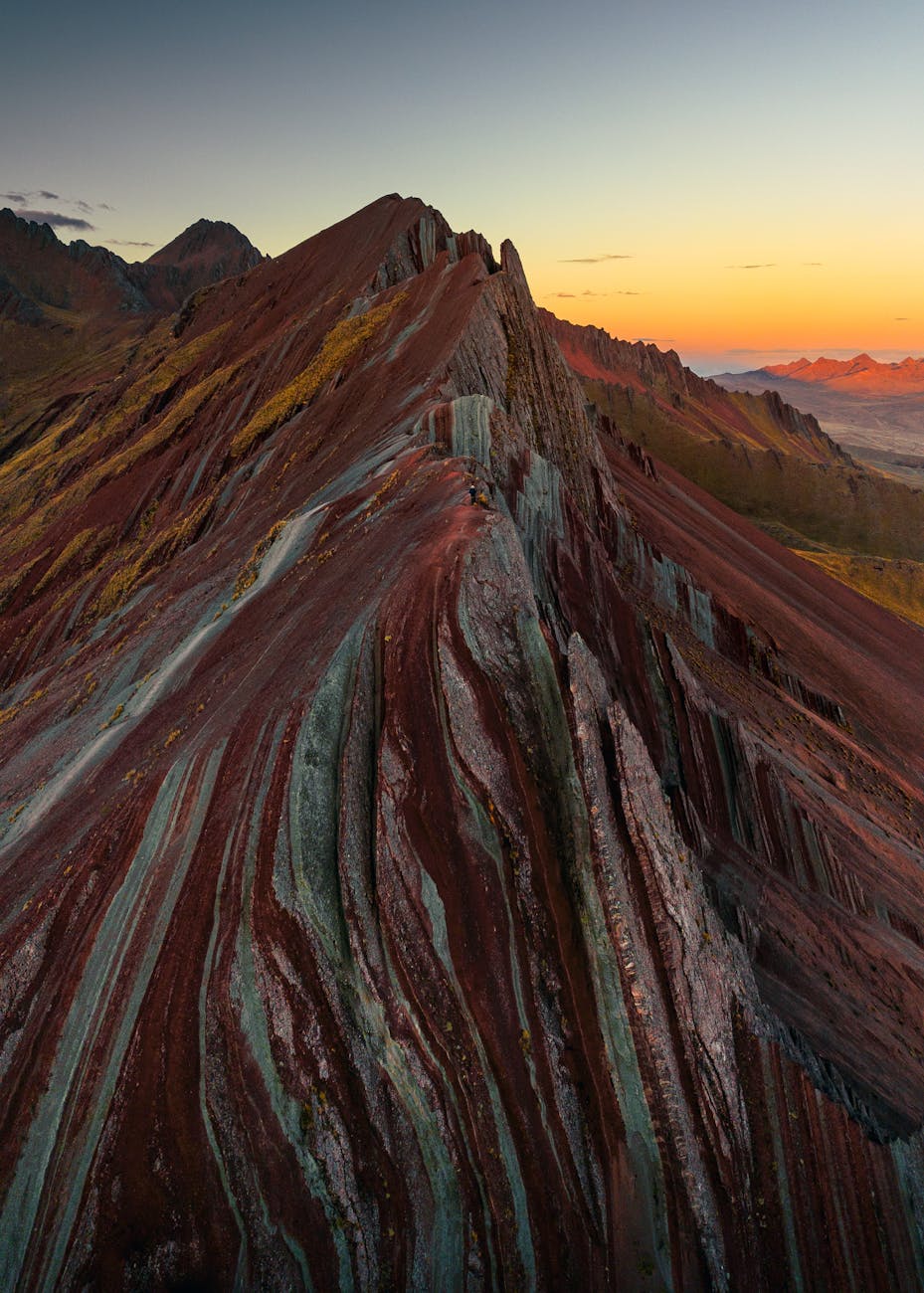 aerial view of rainbow mountain at sunset peru